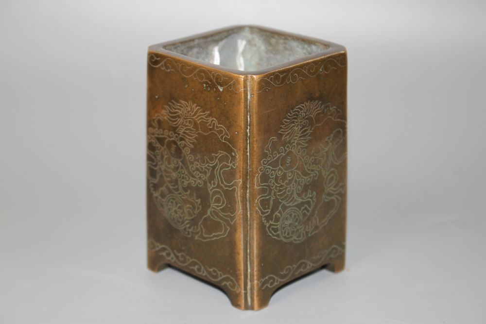 A Chinese bronze and silver inlaid square brush pot,